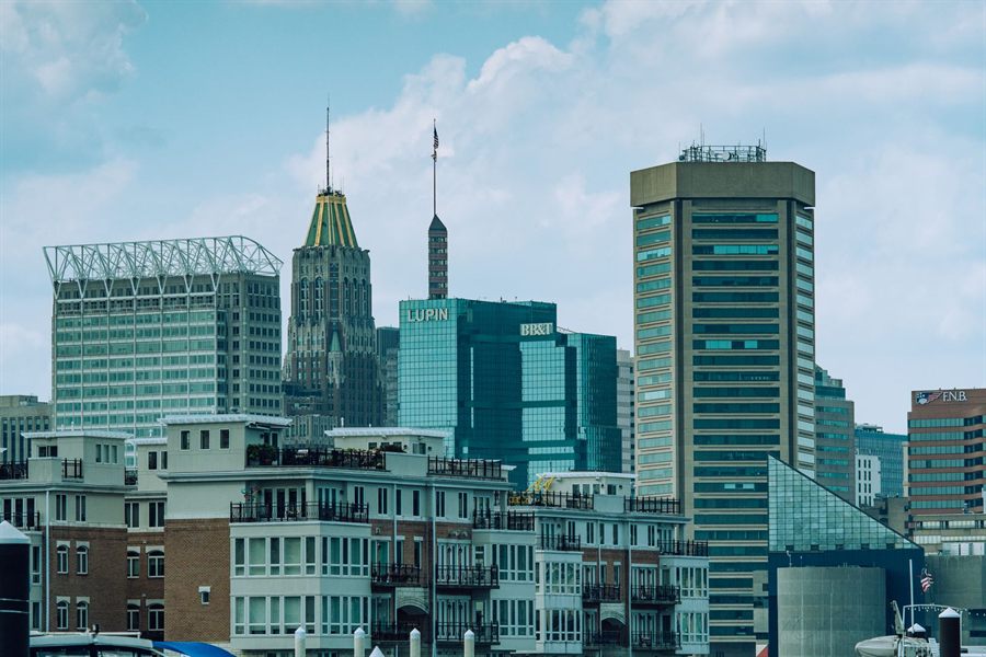 Baltimore skyline of office towers under a clear blue sky